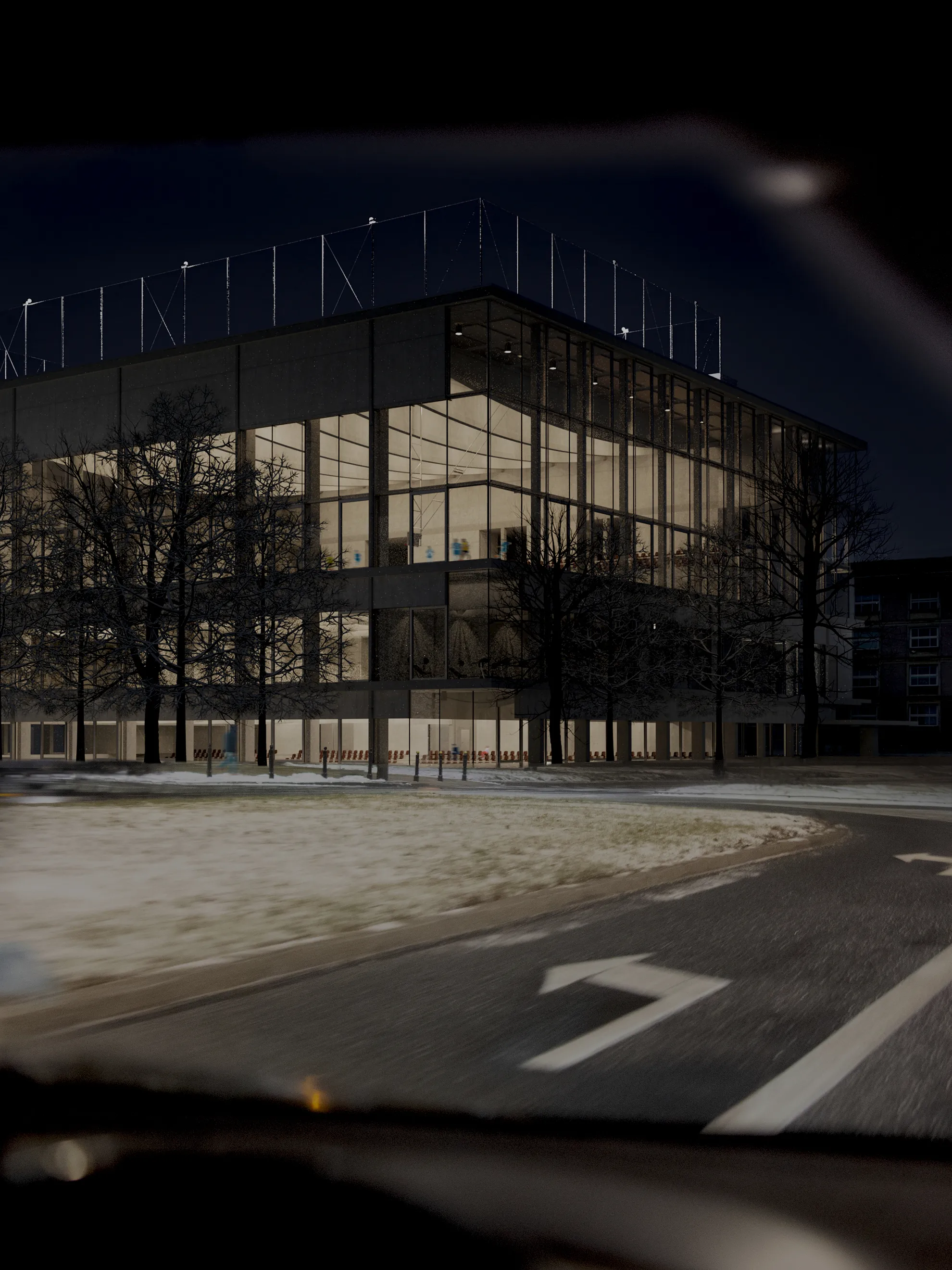Night view from S.Banacha street of the new University of Warsaw Sports and Recreation Center.